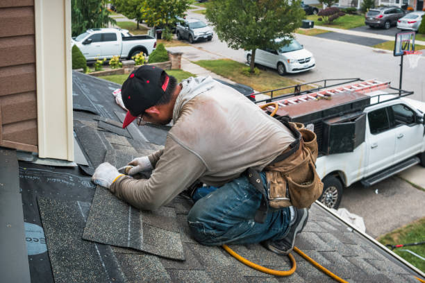 Professional Roofing technician working in Moriches, NY